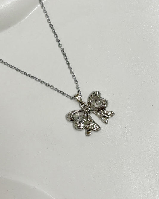 Diamond bow pendant